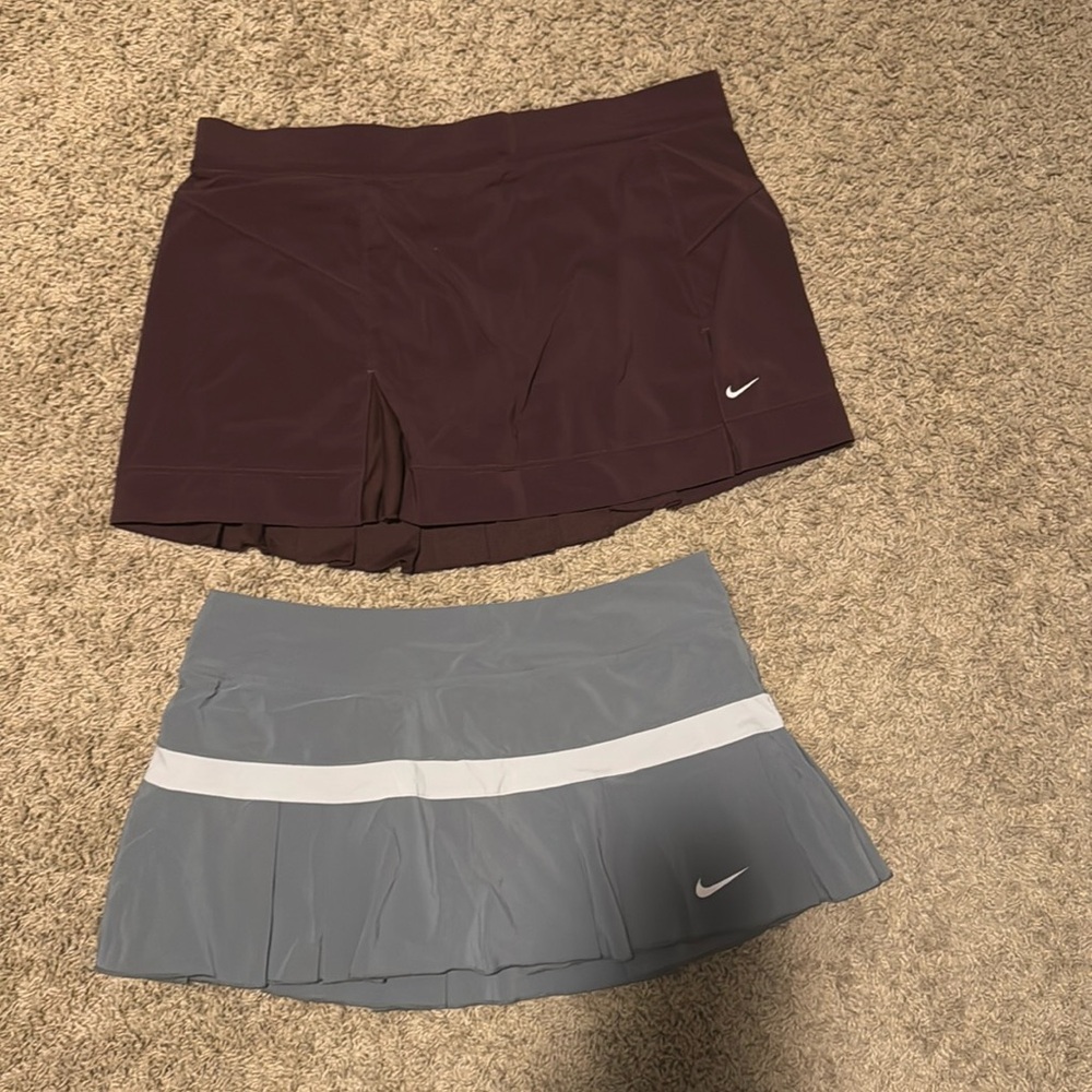 2 Nike size L tennis skirts